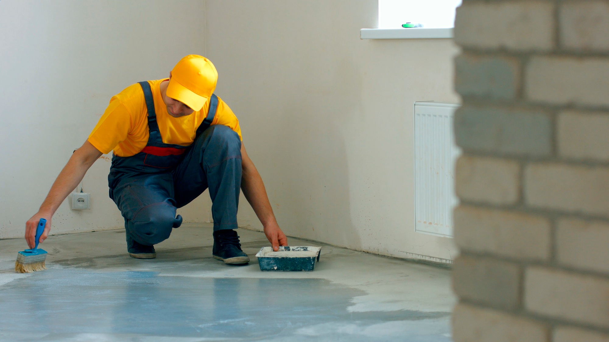 Builder processing concrete.